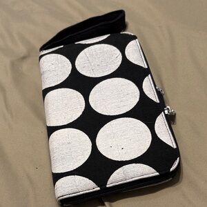 Cute black clutch purse with large white polka dots; double zipper, handle